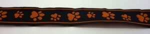 20-064 Webband 20-064, Pfoten auf Schwarz, Orange – für Hundehalsbänder 20 bis 24 mm